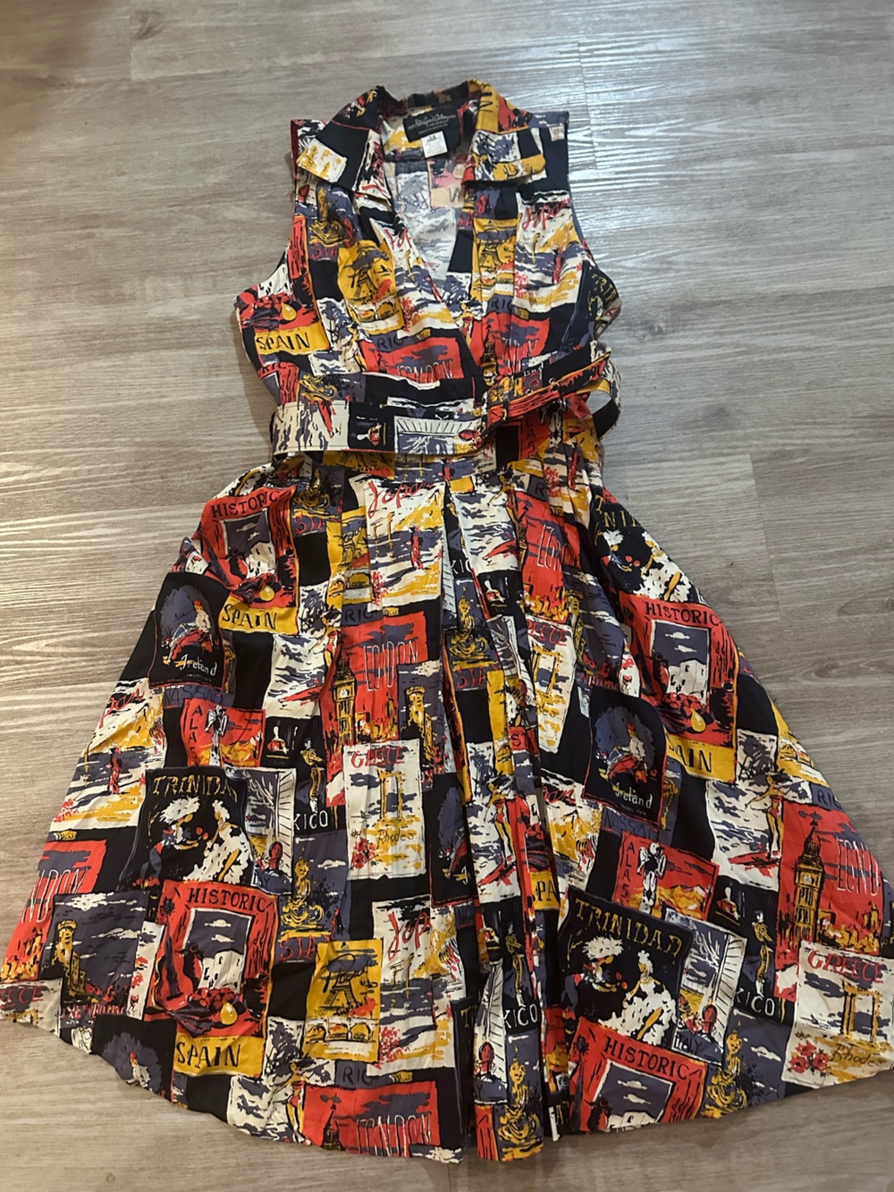 Vintage-Inspired Belted Sleeveless Dress with Travel Destinations